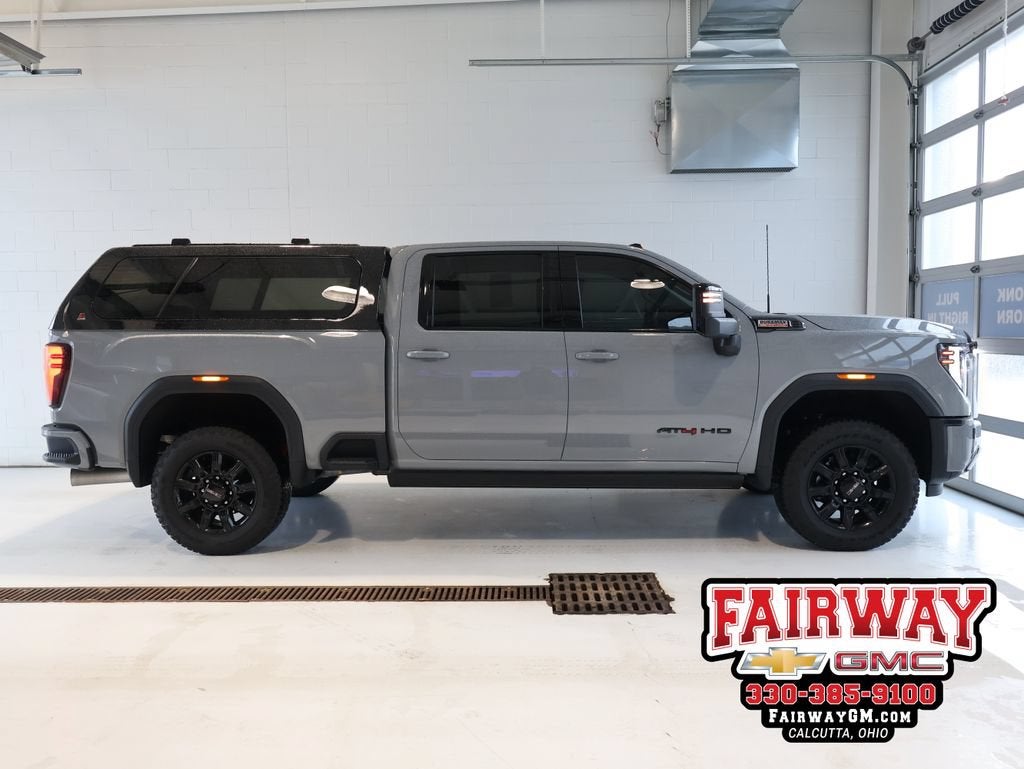 2024 GMC Sierra 2500 HD AT4 in Thunderstorm Gray — front three-quarter view